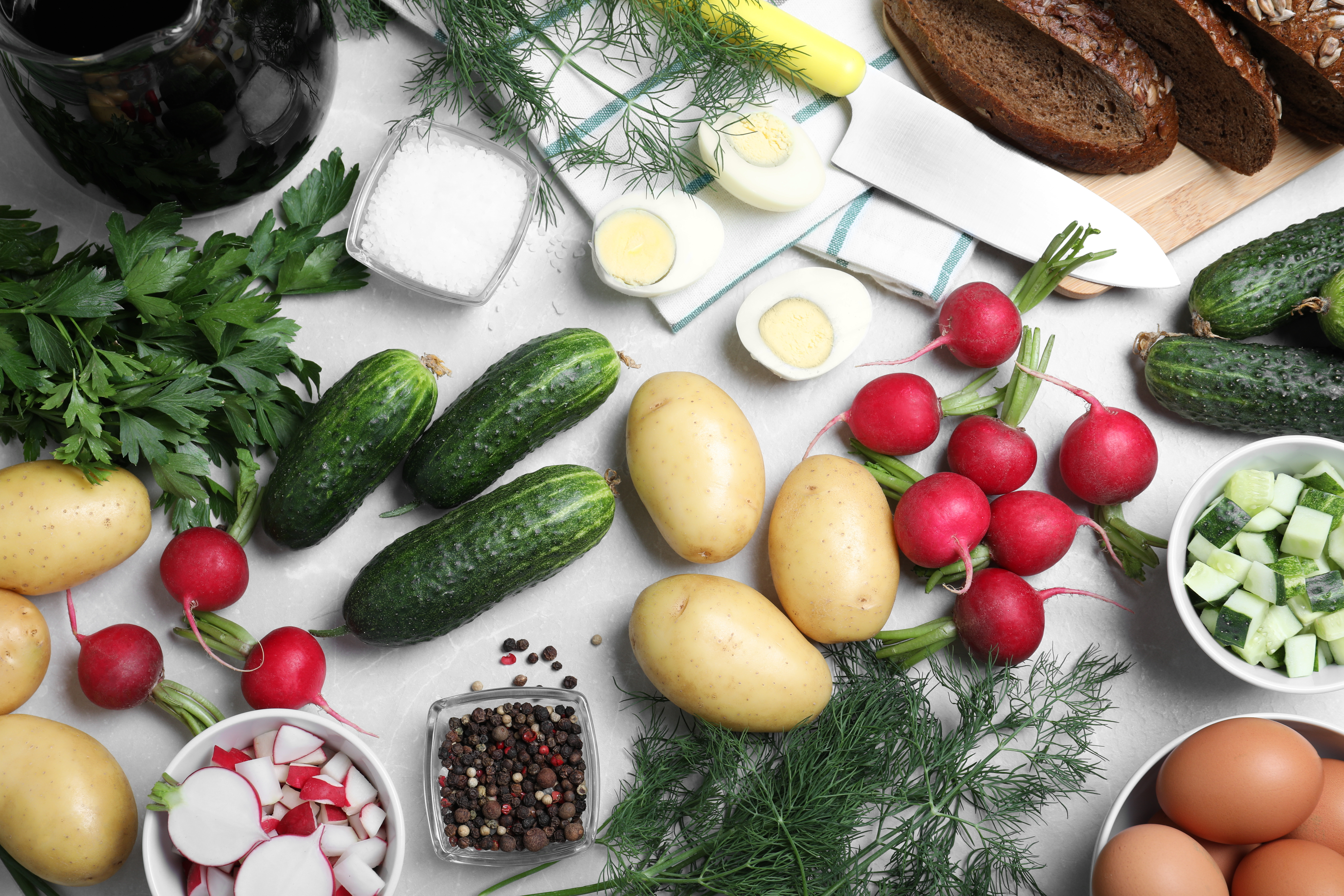 Various ingredients for okroshka (decorative image).