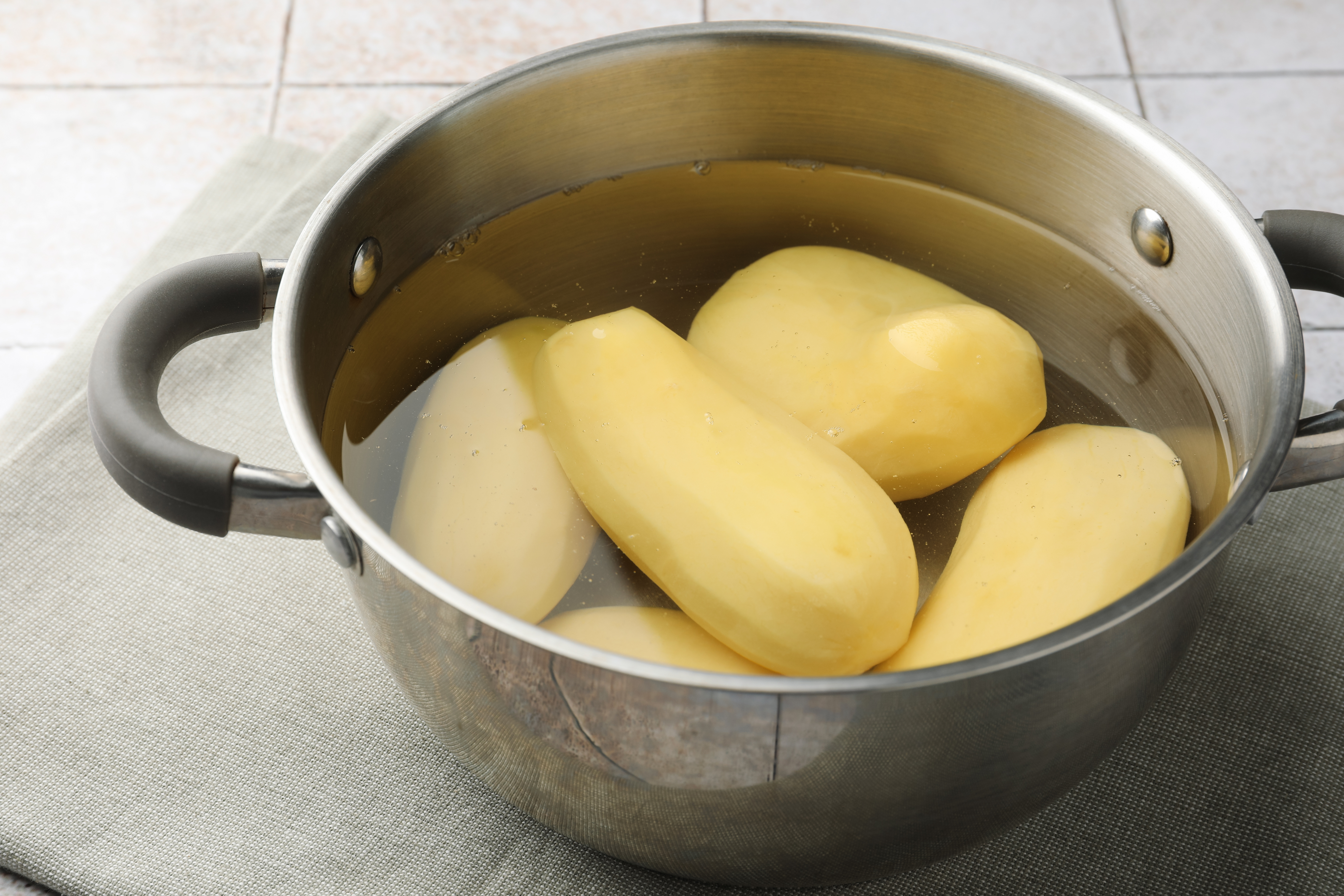 The potatoes are cooked in a pot